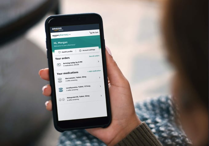 Amazon Pharmacy mobile app on a phone in a person's hand.